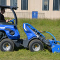 flail mower attachment for mini loader in action